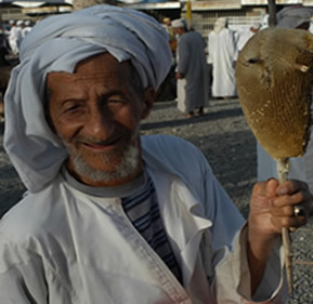 Farmer selling wild honey at Nizwa market